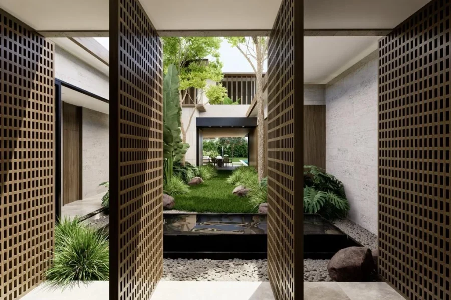 Wood lattice screens frame a tranquil courtyard with green plants, a small pond, and stepping stones.