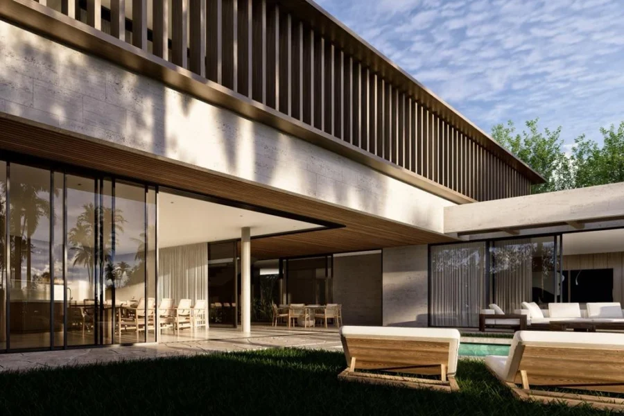 Modern two-story house with glass walls, wooden slats, and an outdoor dining area beside a pool.