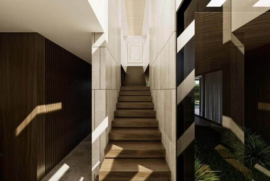 Wooden staircase rising between light stone walls in a modern interior, with dramatic diagonal shadows.